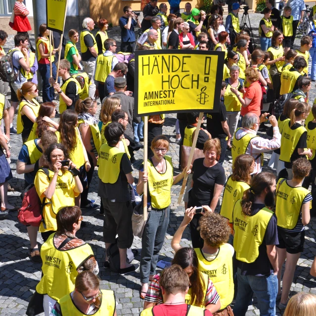 a large group of young s walking in a parade