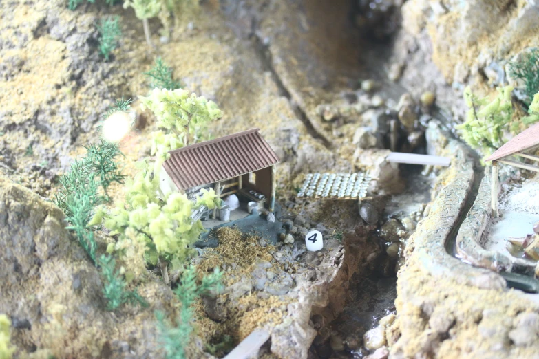 toy landscape displayed for camera on mountainous terrain