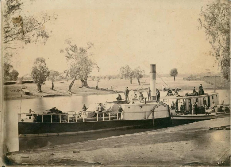 an antique po of a boat traveling along the water