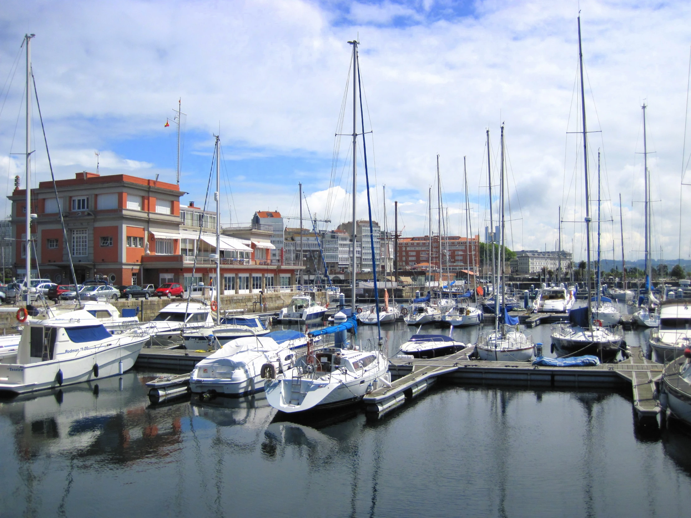 several boats are tied up at a marina