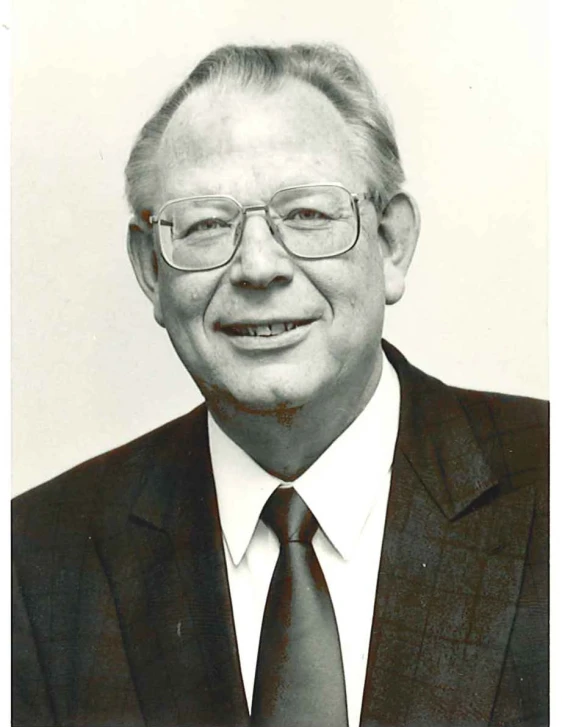 black and white po of an older man in glasses