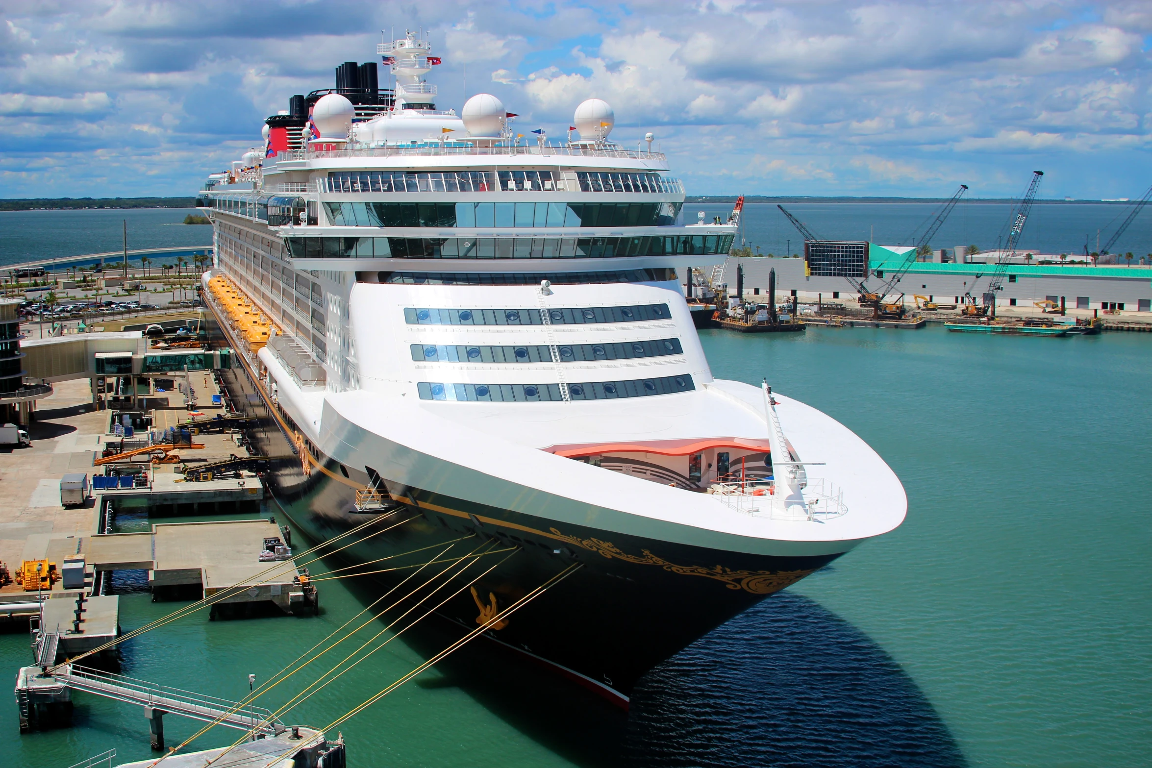 the huge cruise ship is being moved into dock