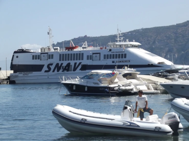 a man standing on a boat in the water