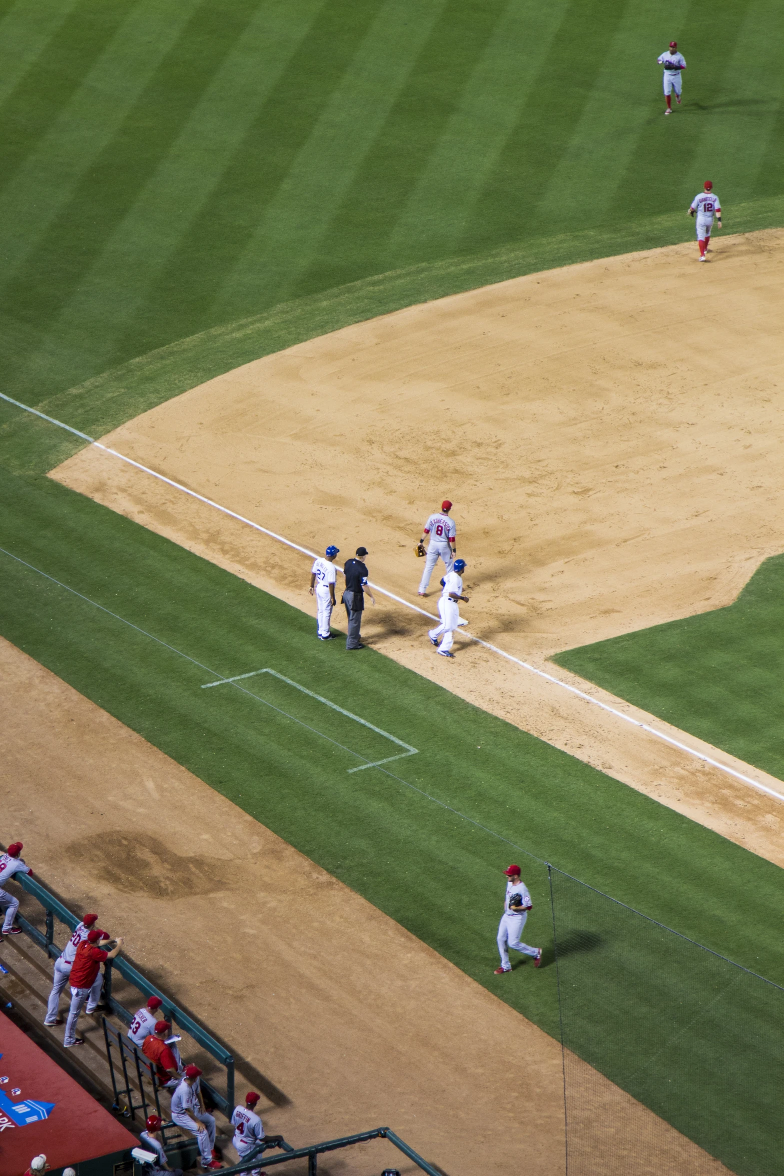 some baseball players are playing on a field