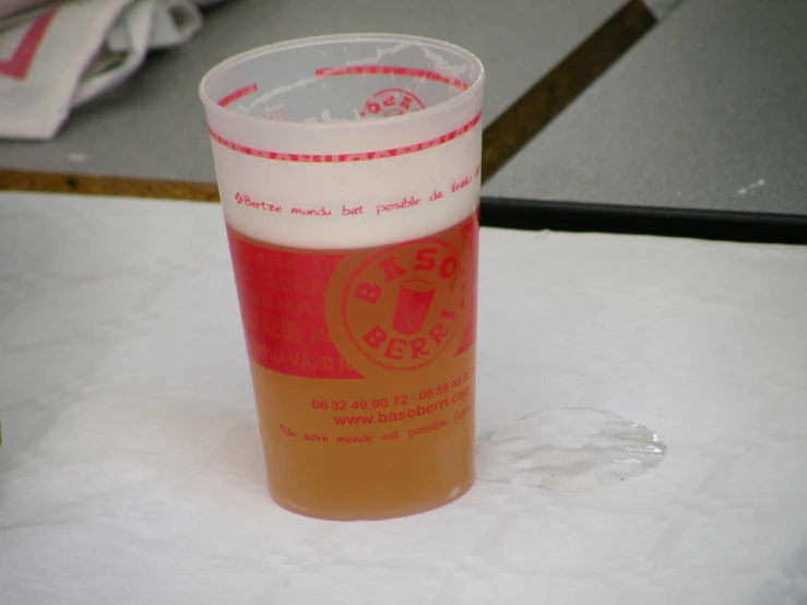 an orange drink with a beverage on the table