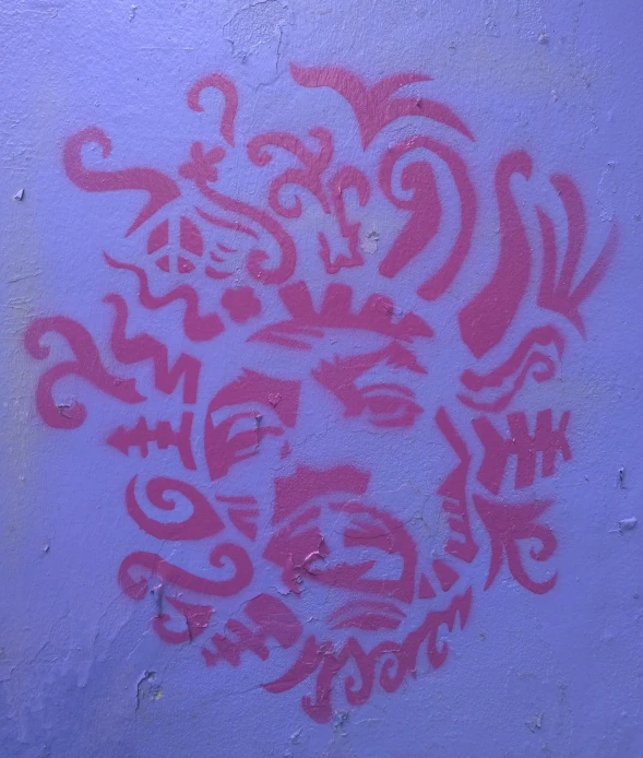 a red flower spray painted on a wall