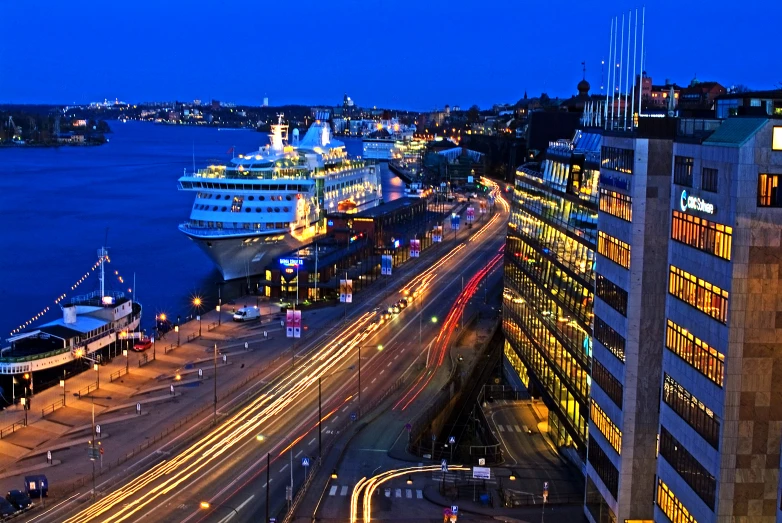 a cruise ship docked at a city pier