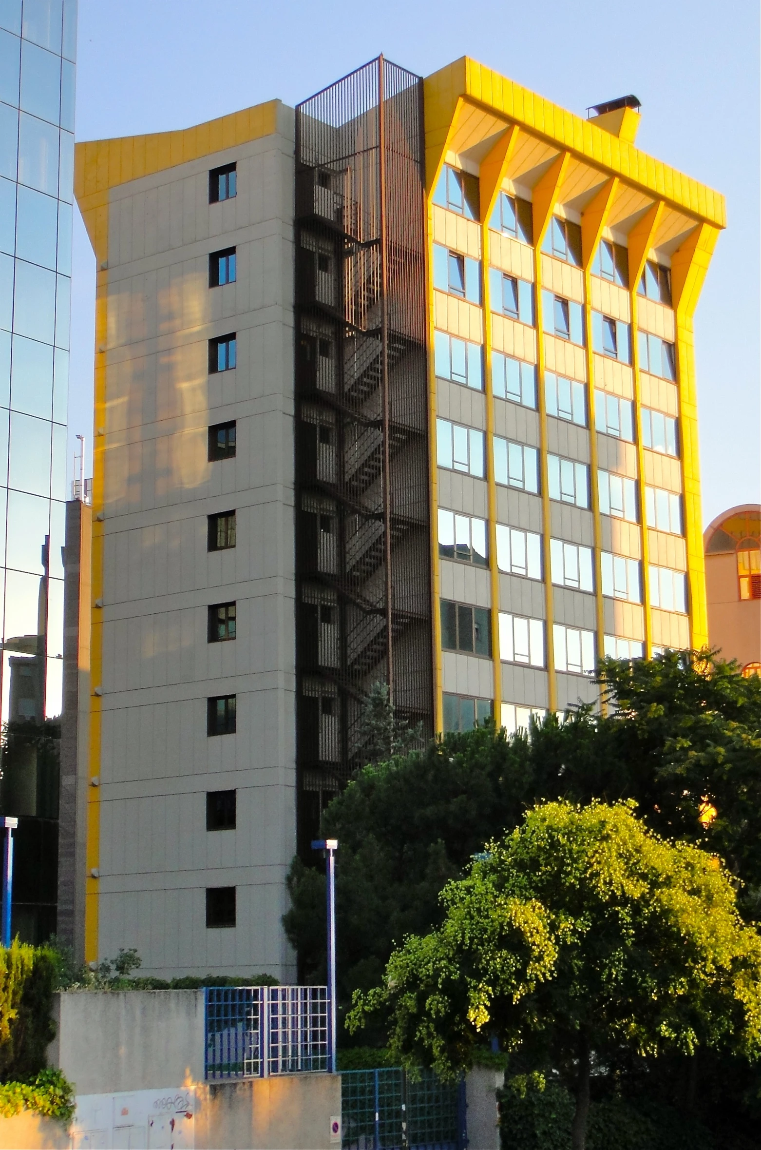 yellow buildings with an elevated stairway leading up to them