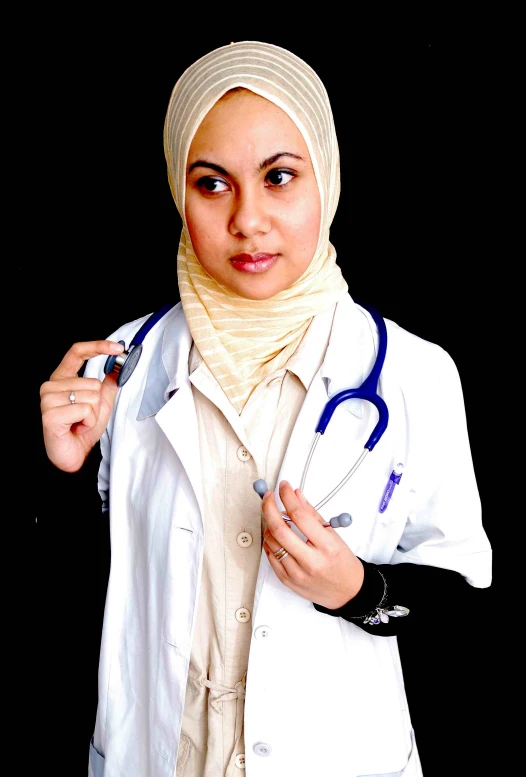 a beautiful woman wearing a white coat holding a clipboard