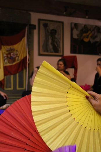 an oriental style umbrella being held by a hand