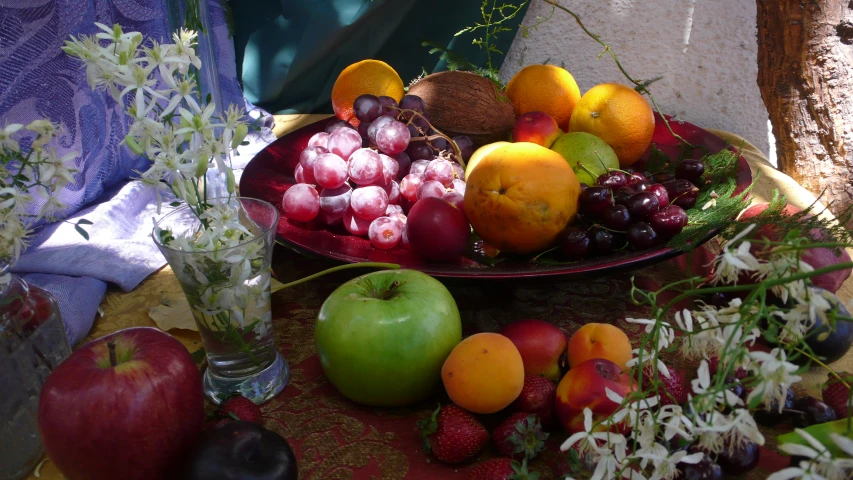 a bowl with fresh fruit is on a table