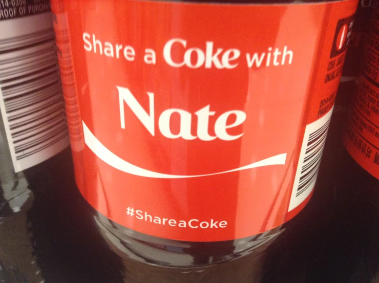 closeup of the back of a can that says share a coke with note