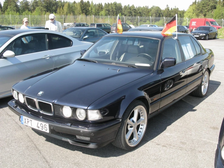 black bmw on display in the parking lot