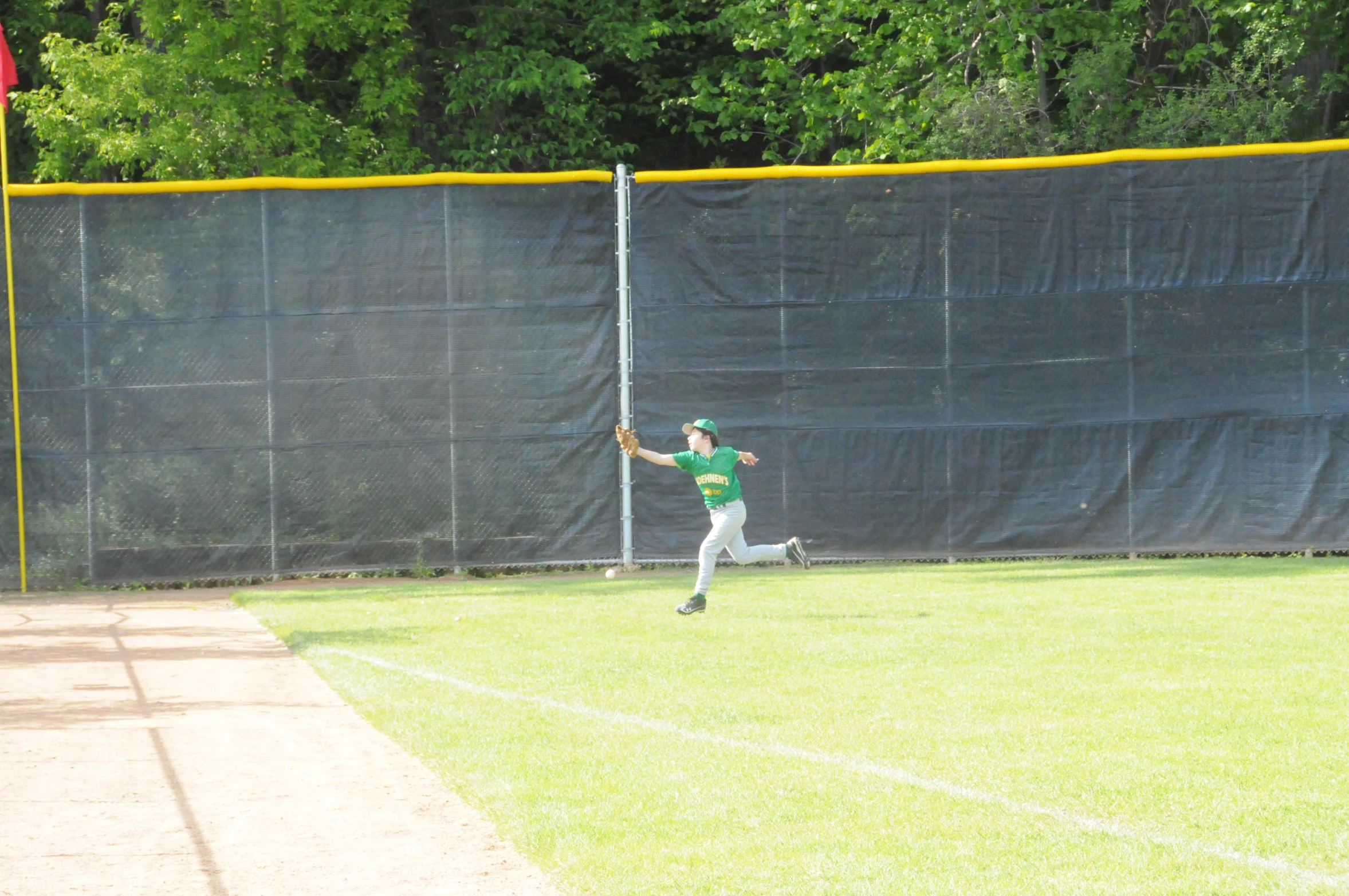 a  with a baseball bat throwing the ball