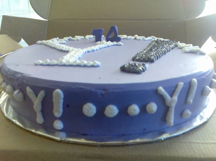 a blue cake with a lot of letters on it