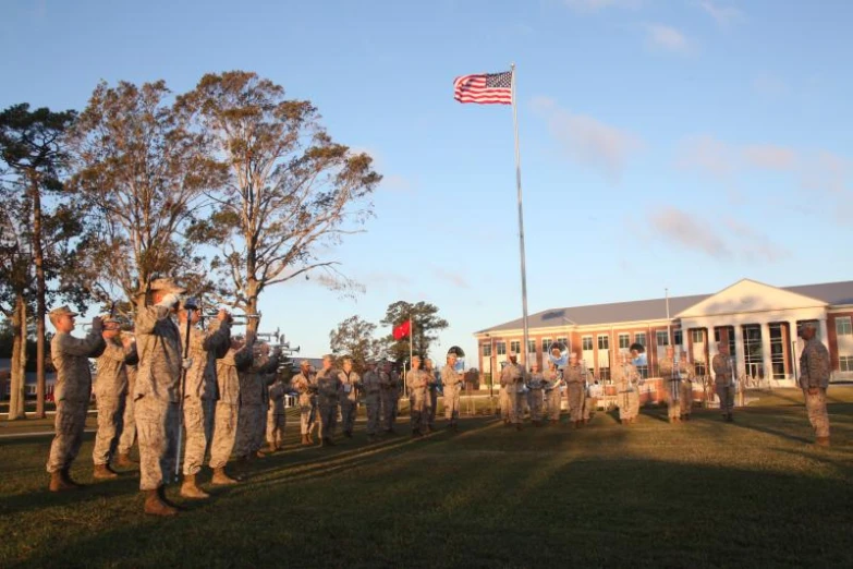 a group of people in uniform standing outside a building