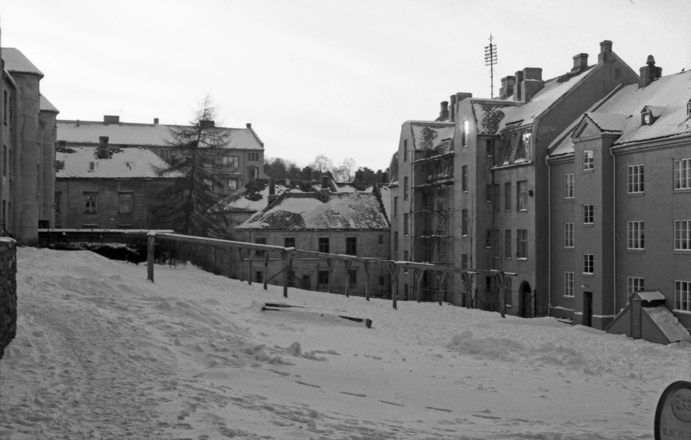 a row of buildings near a snow covered walkway