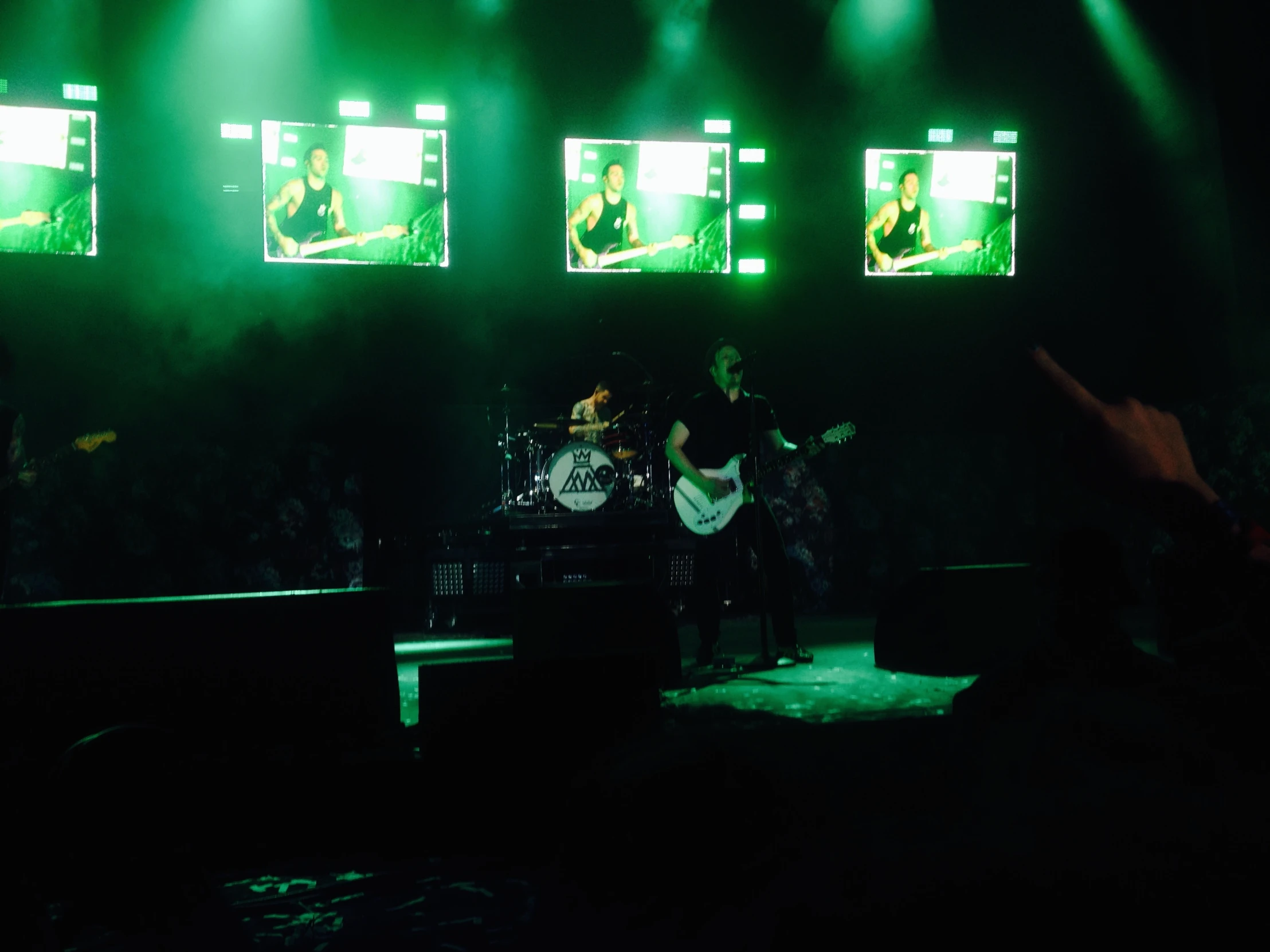 two bandmen playing music on stage at a concert