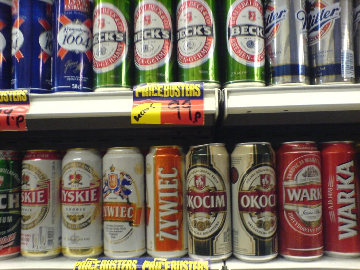 the shelf full of various flavored cans of various beers