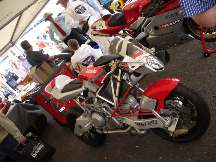 a row of motorcycles are being worked on