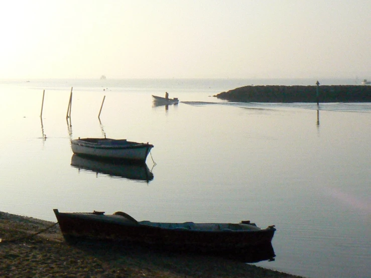 two small boats in a body of water