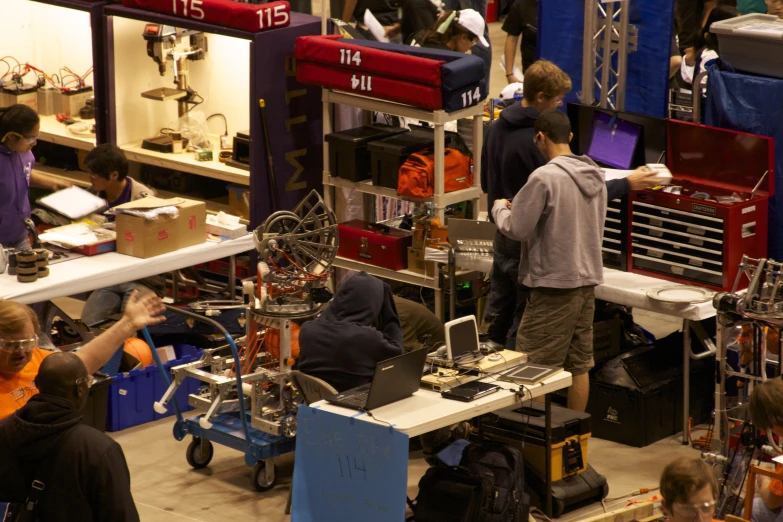 a group of people working at various computers