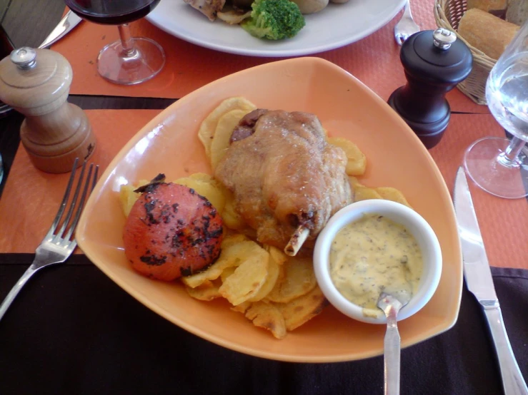 a plate filled with some tasty looking food next to a fork