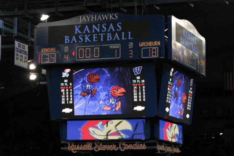 the scoreboard of an indoor basketball game