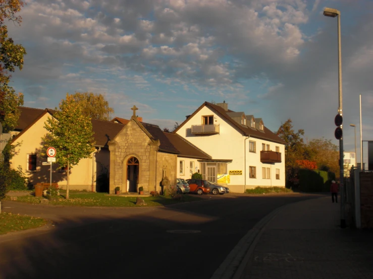 a small town in the middle of a street with a large building