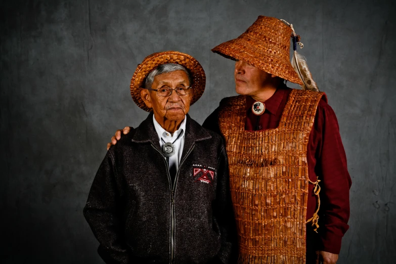 two older people are dressed up for an interesting pose