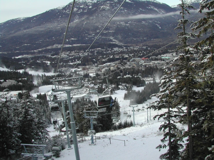 a snowy landscape with the ski lift on top