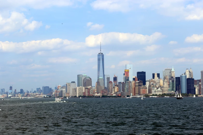 the skyline is visible on a bright day in new york city