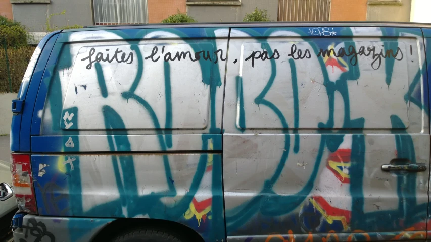 an old van with colorful graffiti in the city