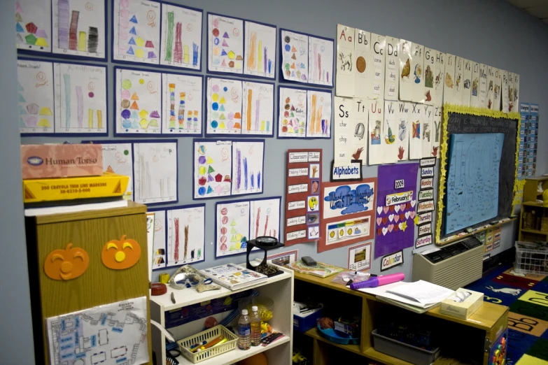 a large classroom with an assortment of art work