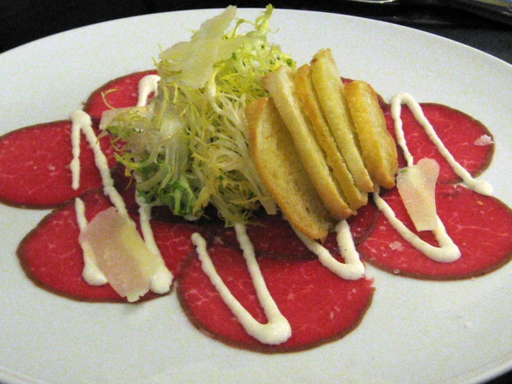 a plate with many different kinds of food on it