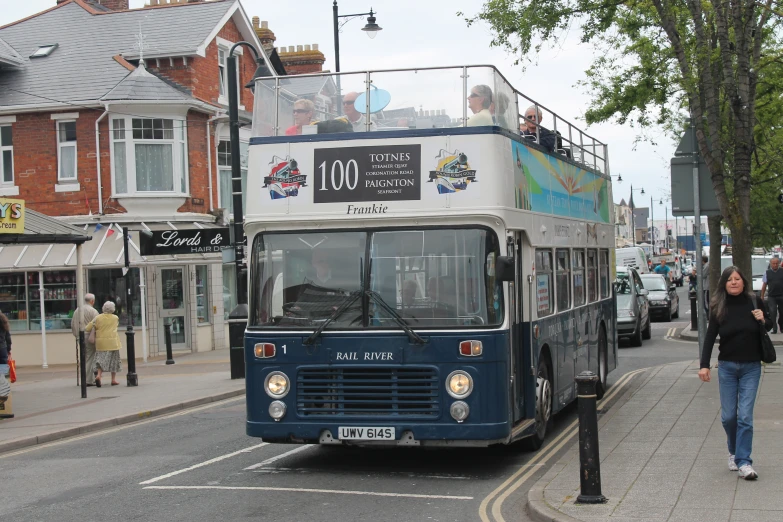 a double decker bus traveling down the street