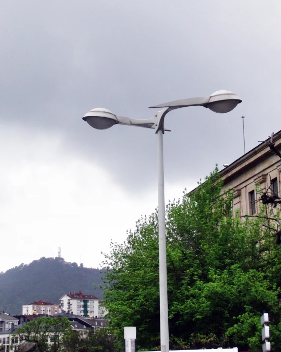 street lamps on poles by an old building