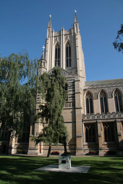 the large building with a clock tower stands alone