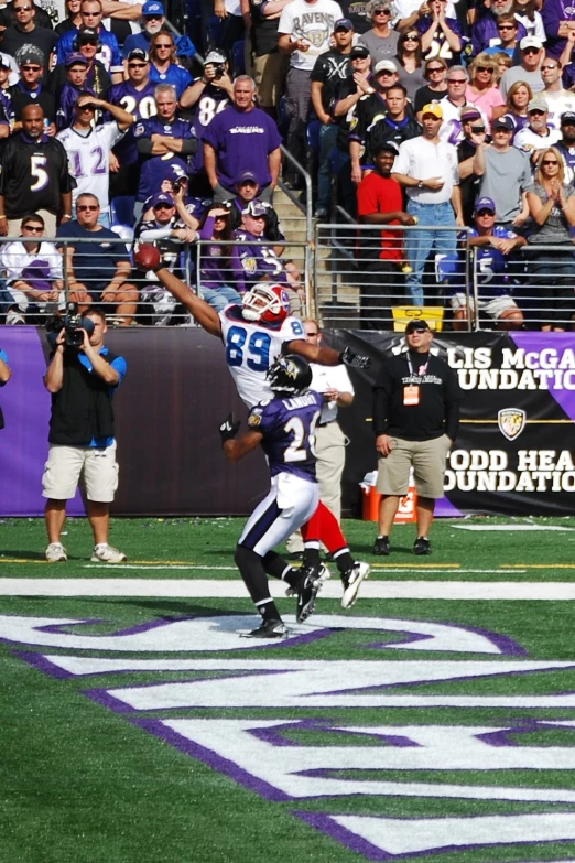 the baltimore receiver catches the ball during a game
