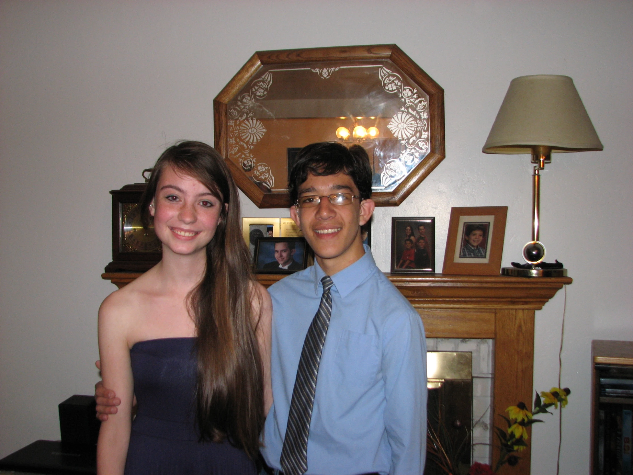 two people are posing for a picture with long hair