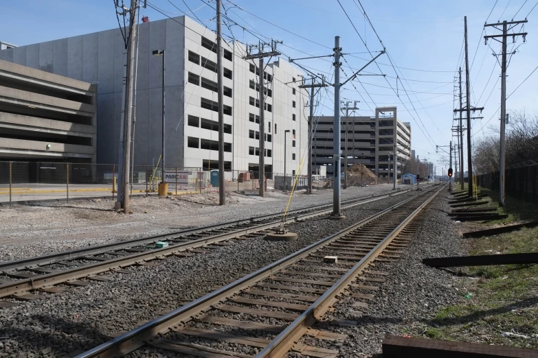 some train tracks near a building and a building