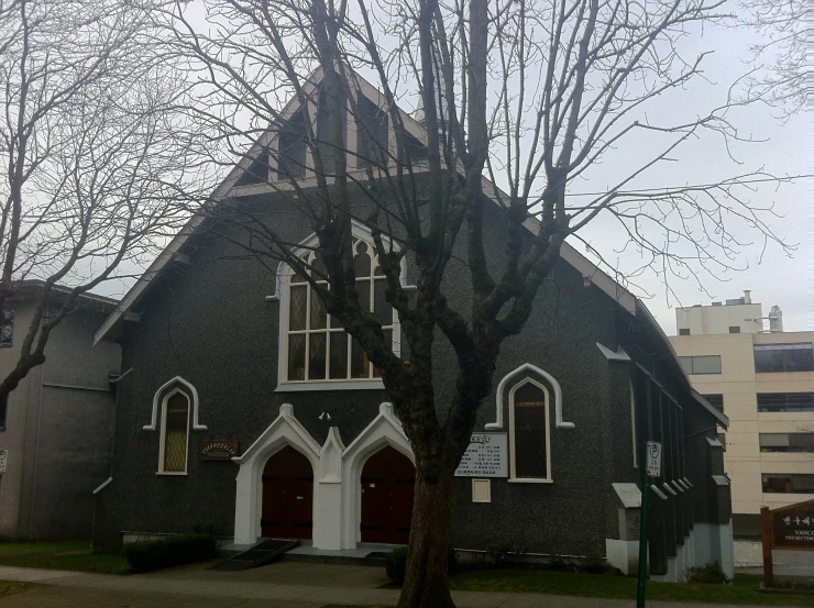a black church with arched windows is pictured