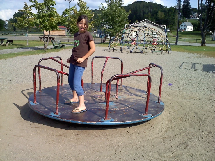 woman standing on a play equipment set in a park