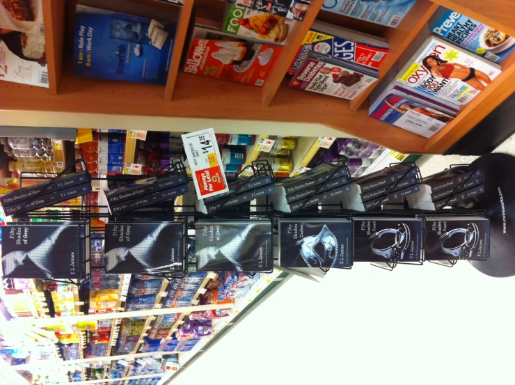 a shelf filled with different kind of cds