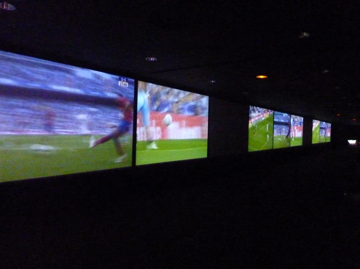 an animated soccer game projected in an art exhibit