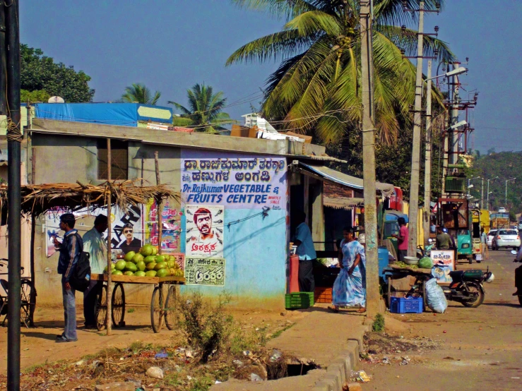 a small food cart with fruit in a rural area