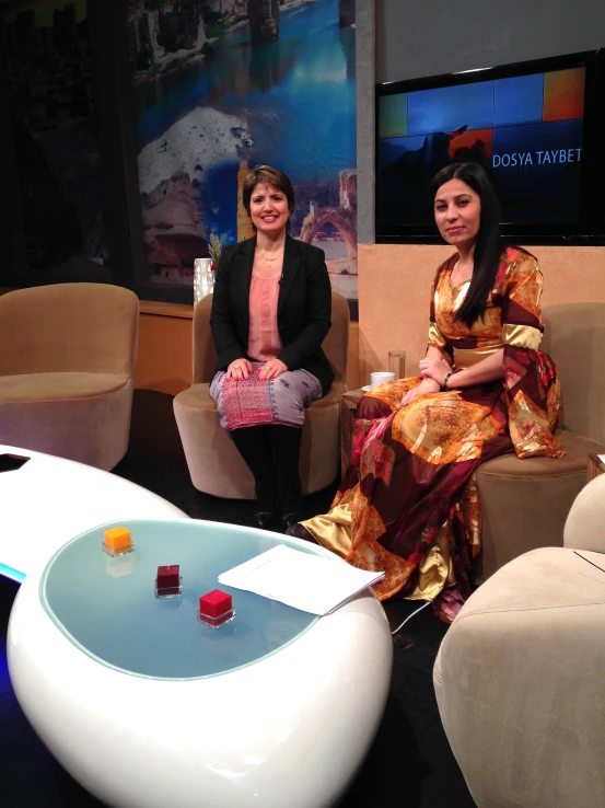 two women are talking to one another on the set of this television