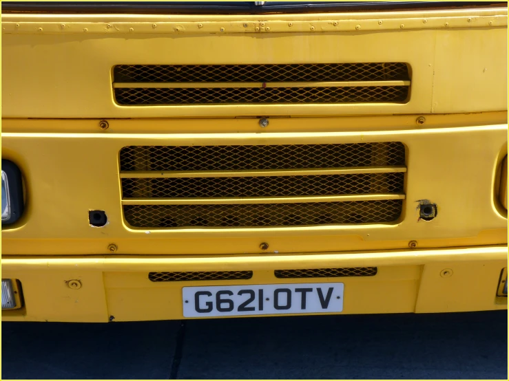 the front of an old yellow school bus