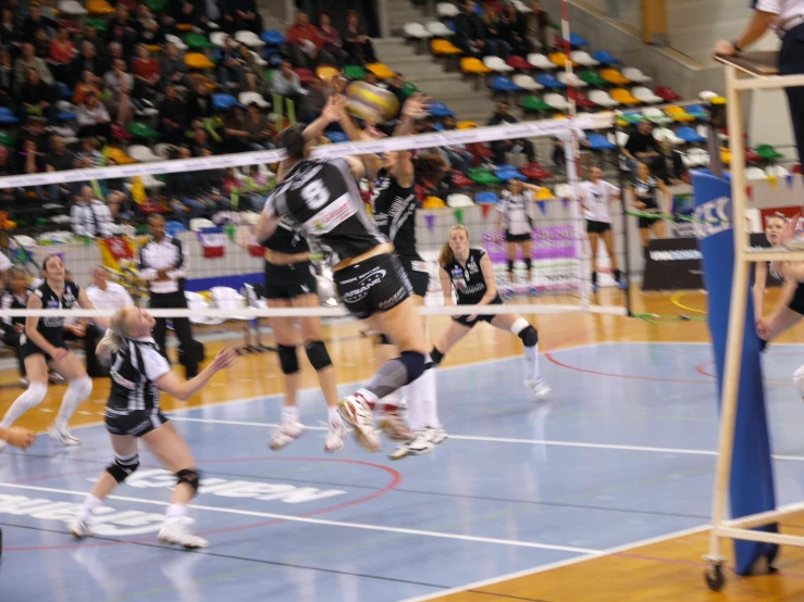 some volleyball players in action on the court