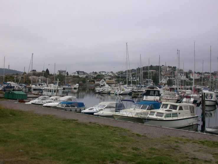 boats docked at a pier on the water